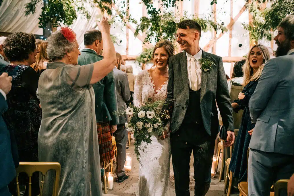 ust married Bride and Groom exit their Barn Ceremony at South Farm Lee Allision Photography alternative-south-farm-wedding