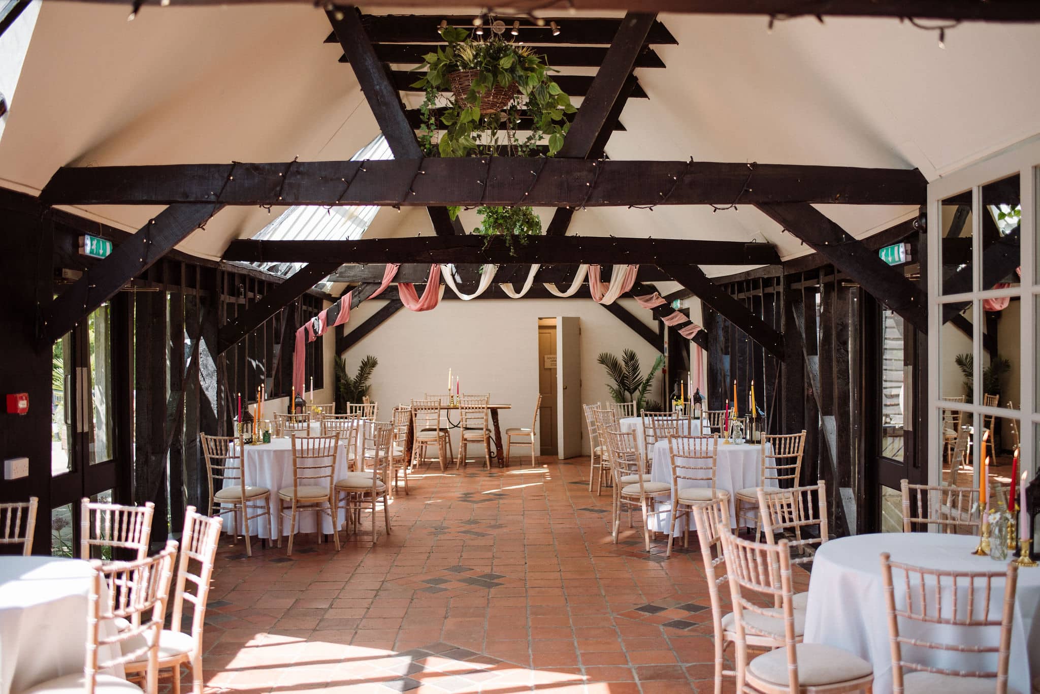 The rustic Old Dairy all set for a drinks reception at country house wedding venue