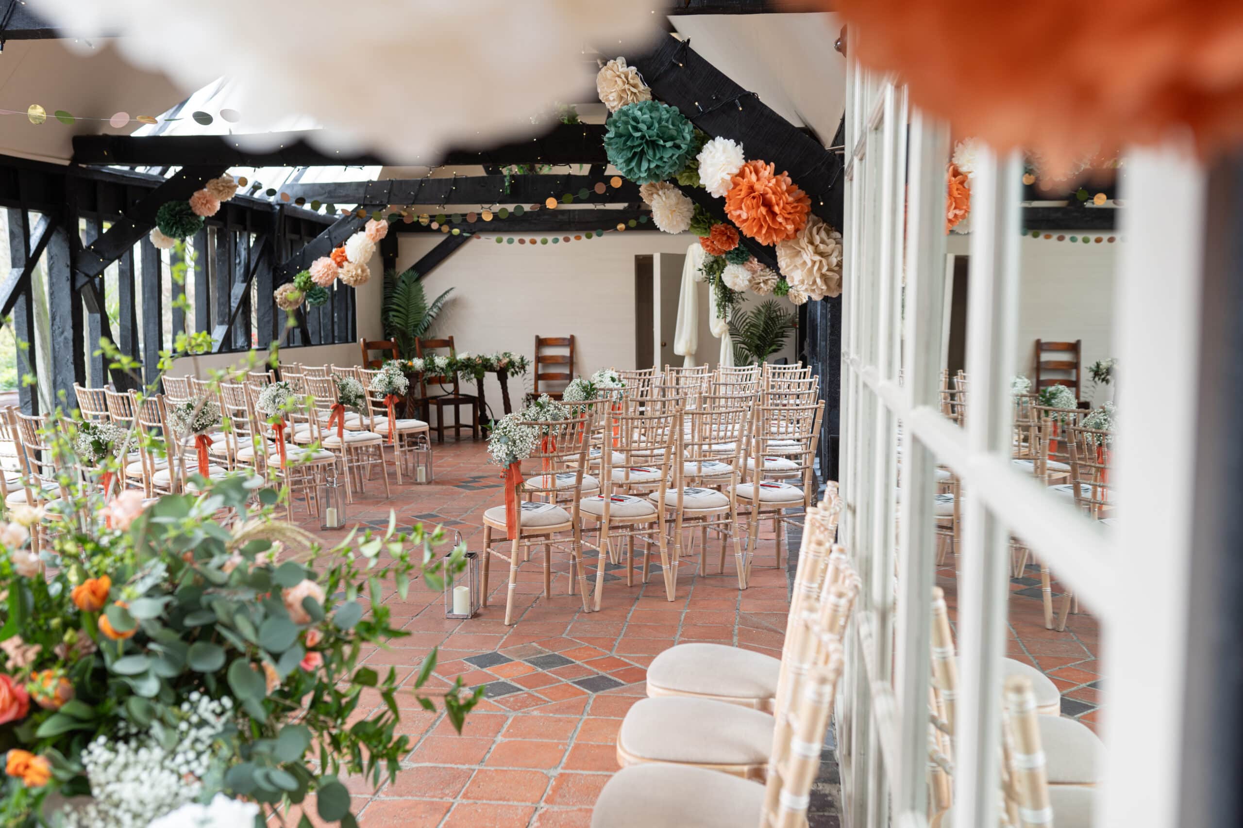 The Old Dairy set out with gorgeous spring colours and florals and white chivari chairs