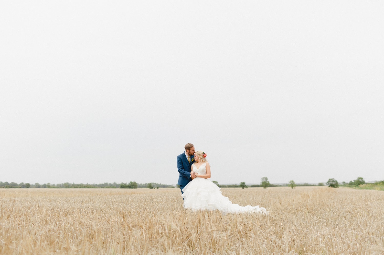 Just Married Couple at Farm Wedding Venue in crop field