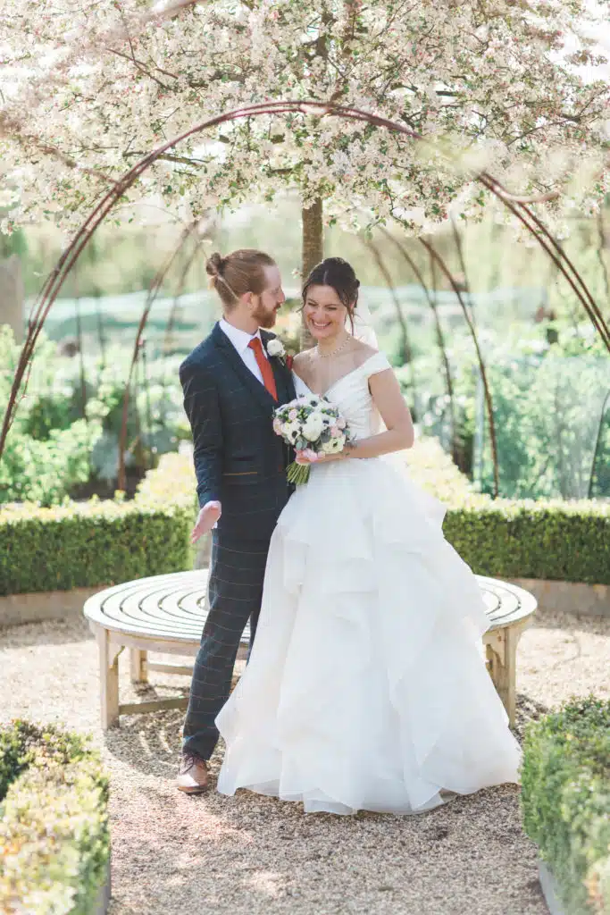 Spring Wedding Couple under blossom tree at South Farm