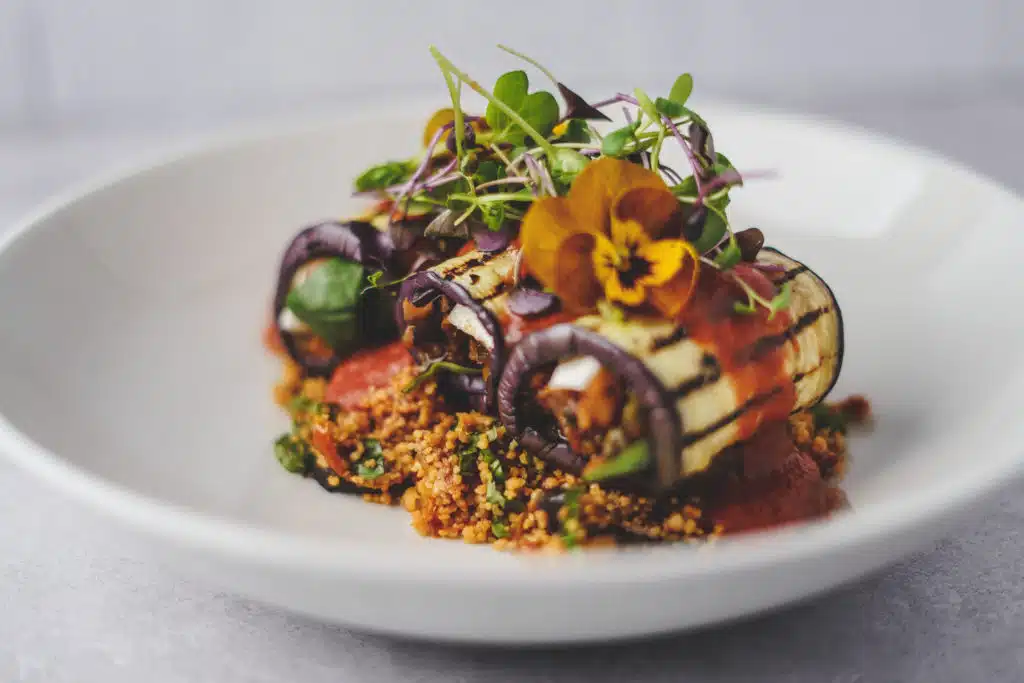 Aubergine Cannelloni at Farm wedding venue using homegrown ingrediants and colourful flowers