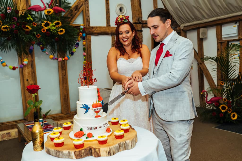 Wedding-Cake-Cutting-at-Barn-Wedding-Venue-Tom-Calton