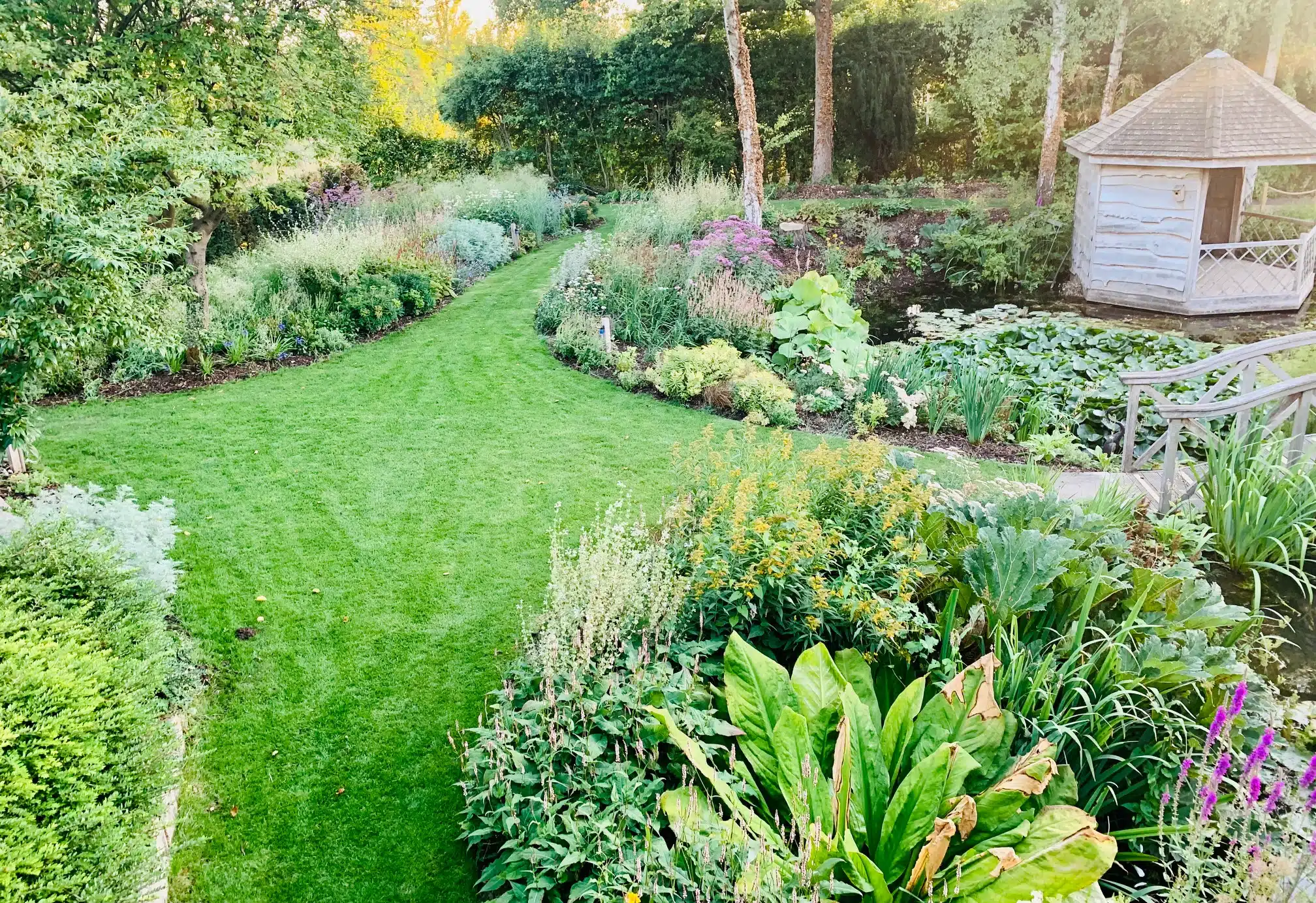 Countryside Wedding Venue Green Garden paths and pretty rustic summerhouse