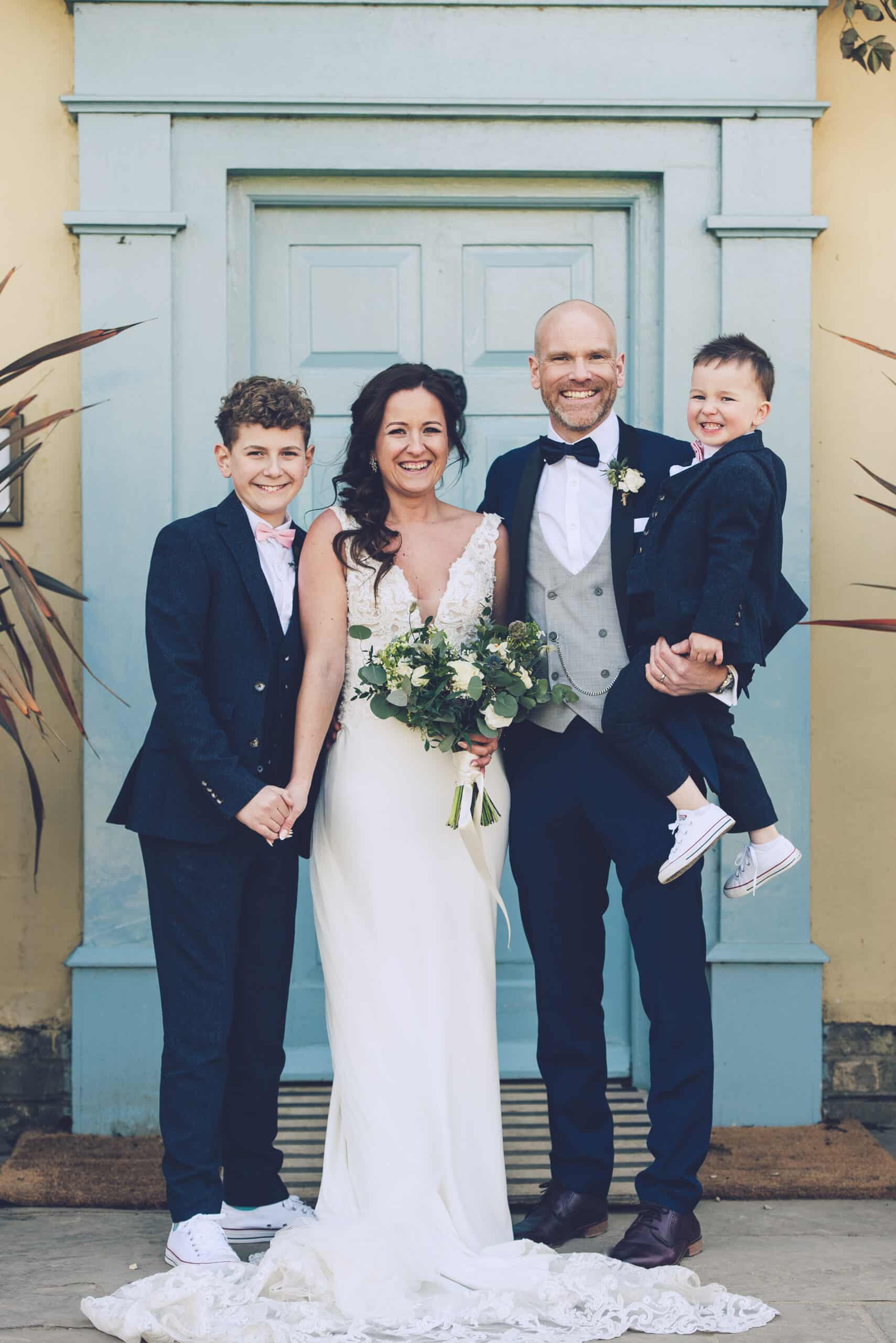 Family of four on wedding day