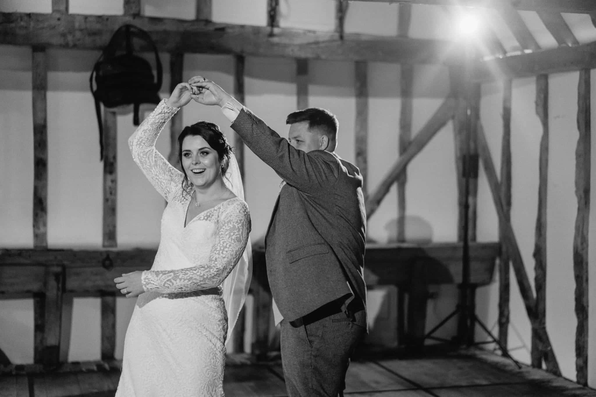 Black and White photo of Bride and Groom having their first dance at Barn Wedding Venue