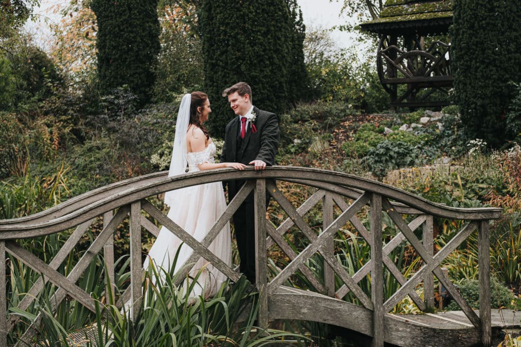 Bride and Groom on Monet Bridge at Garden Wedding Venue