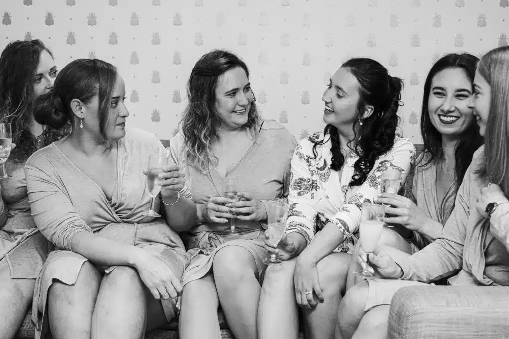 Bride and Bridesmaids share a moment on morning of wedding day