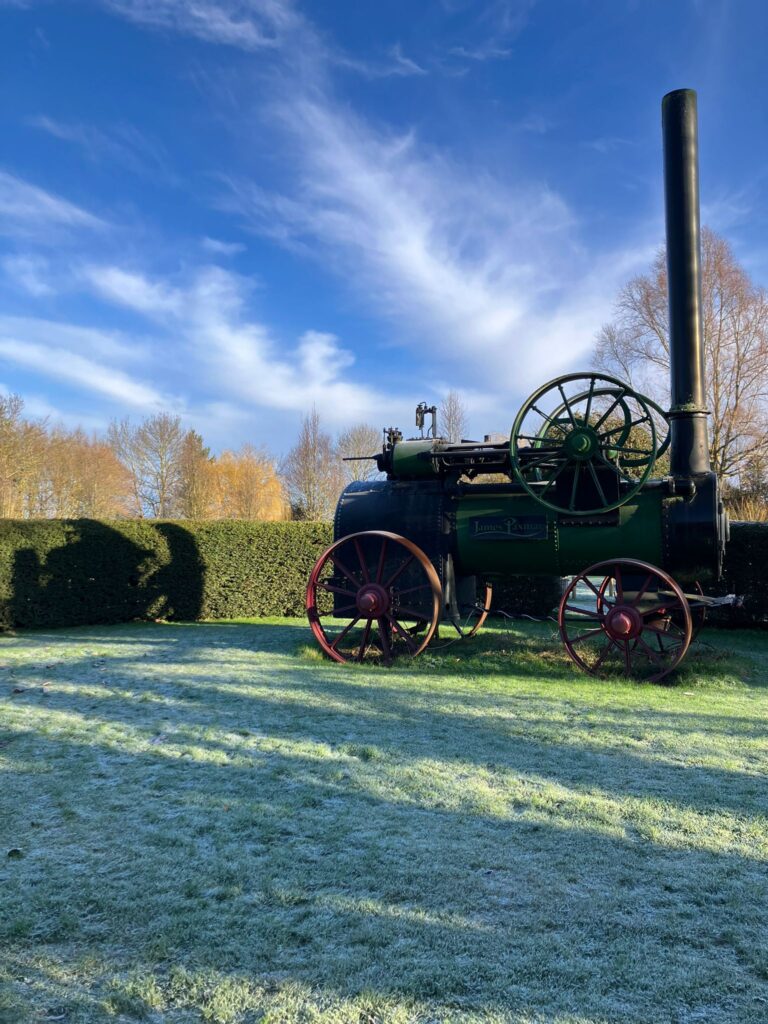 January frost at Wedding venue with vintage steam engine under blue skies
