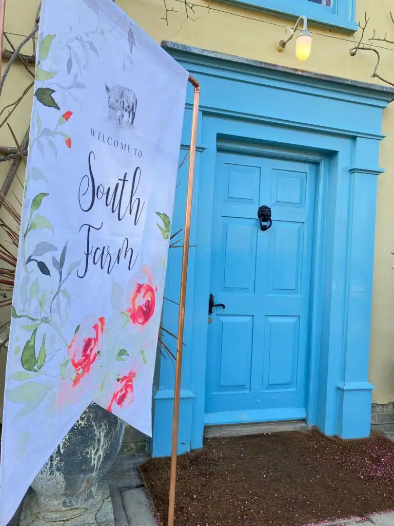 South Farm Wedding Venue Open House Event  Welcome sign in front of blue door 