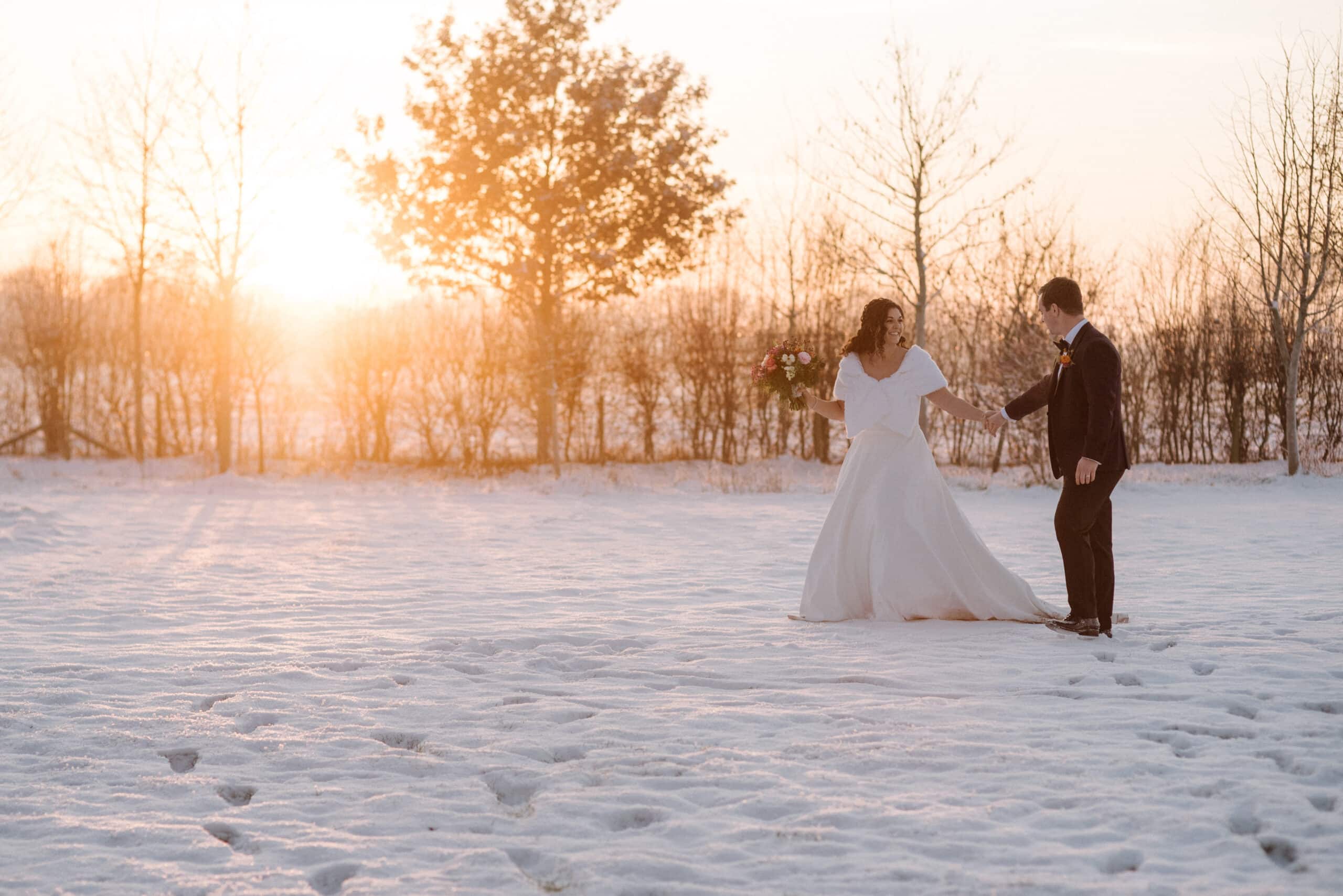 Snowy winter wedding at sunset