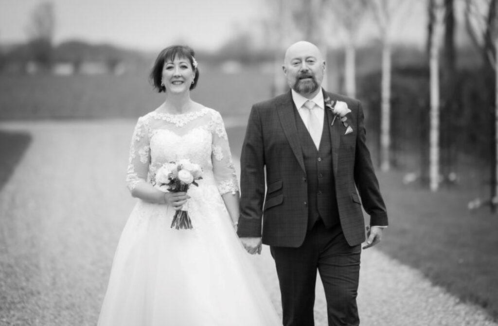 Black and white photo of bride and groom on wedding day