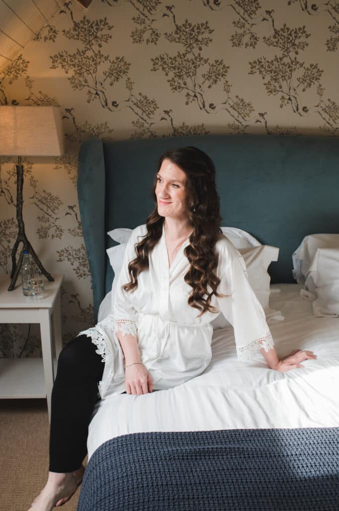 Bride on wedding day takes a moment to have a calm photo in bridal suite at Jewish Wedding 