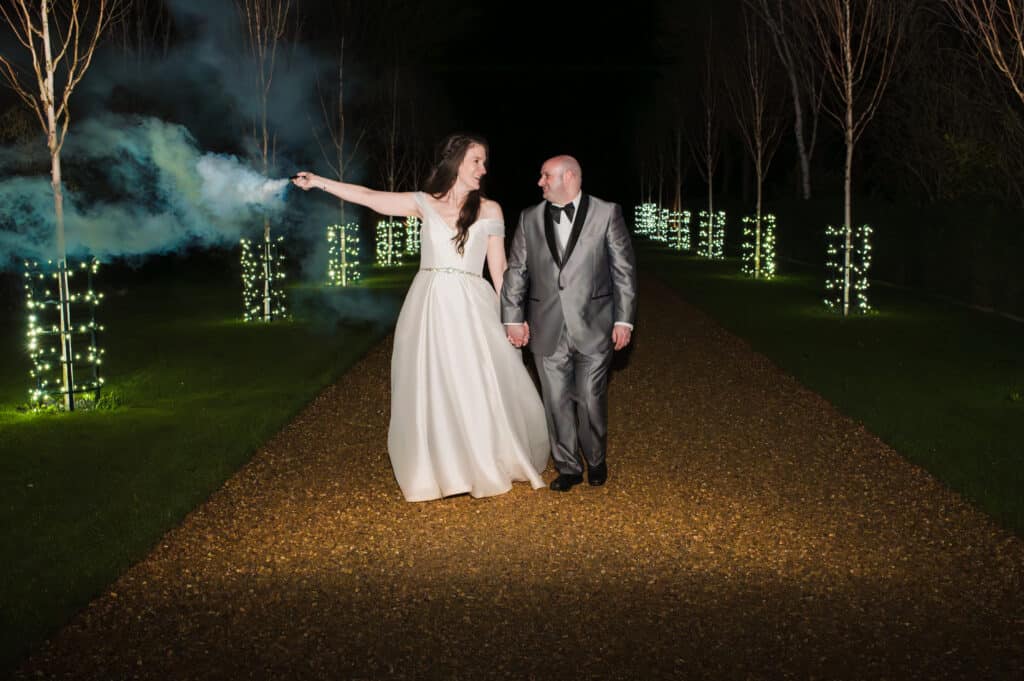 Bride and Groom at countryside wedding venue on fairy lit driveway Jewish Wedding 