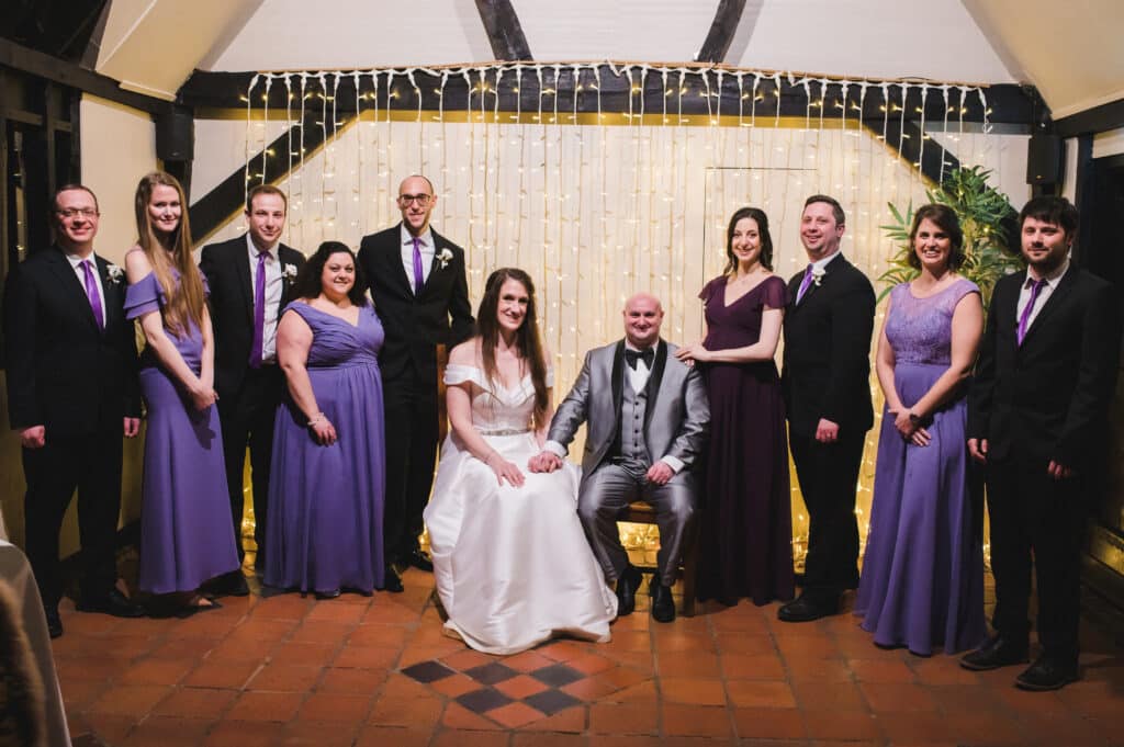 Group Photo of Bride, Groom and bridesmaids and groomsmen at barn wedding venue 