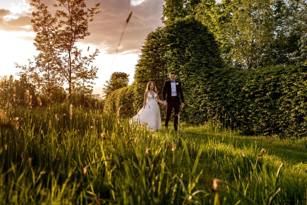 Couple enjoying the gardens at countryside wedding venue 