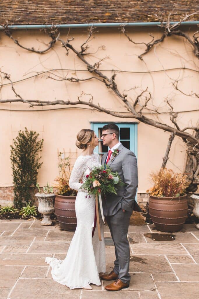Bride and Groom share a special moment on wedding day at country farmhouse wedding venue 