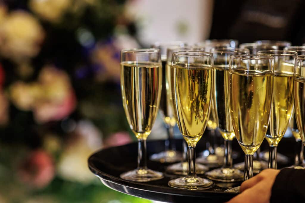 Tray of champagne being served to guests