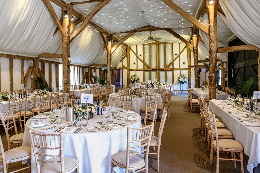 Barn wedding venue set for wedding dinner