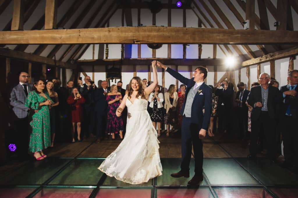 Bride and Groom during first dance at rustic barn wedding venue