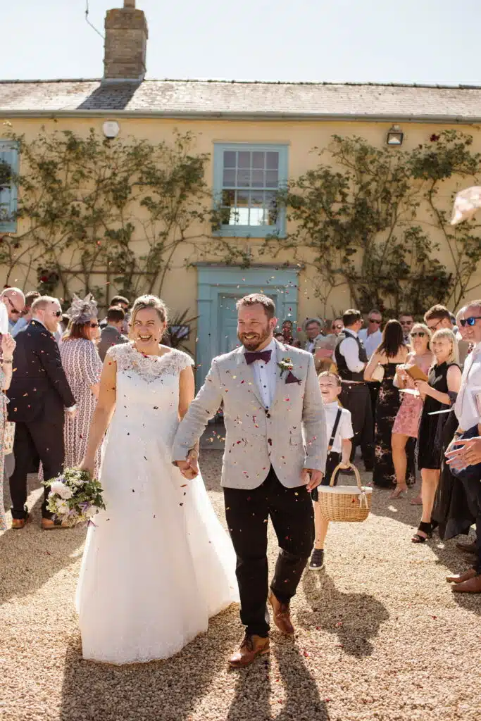 Bride and groom at wedding venue on a sunny day