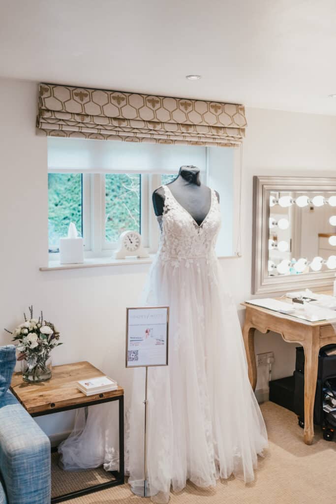 Stunning white wedding dress in honeymoon suite at award winning wedding venue