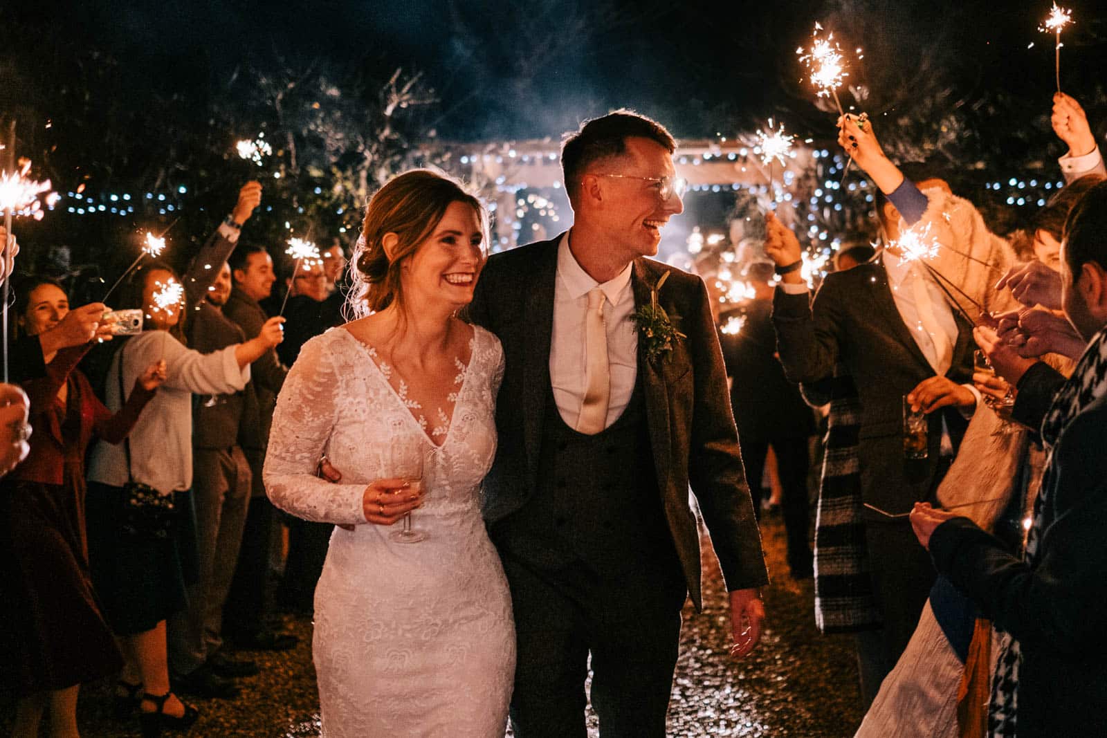 Bride and Groom Sparkler wedding photo with guests at South Farm rustic barn wedding venue Cambridgeshire Lee Allison Photography