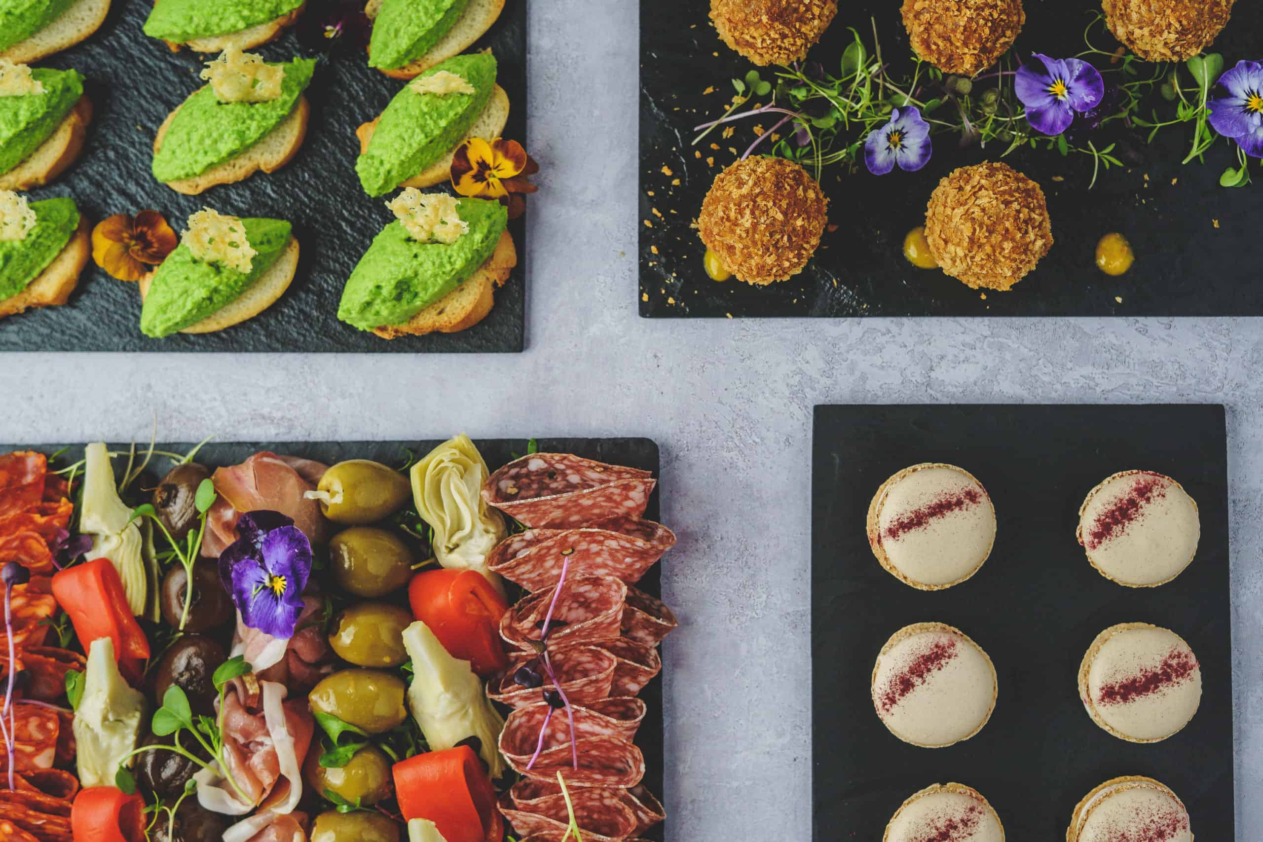 Delicious wedding canapes set on slates ready for service at foodie wedding venue