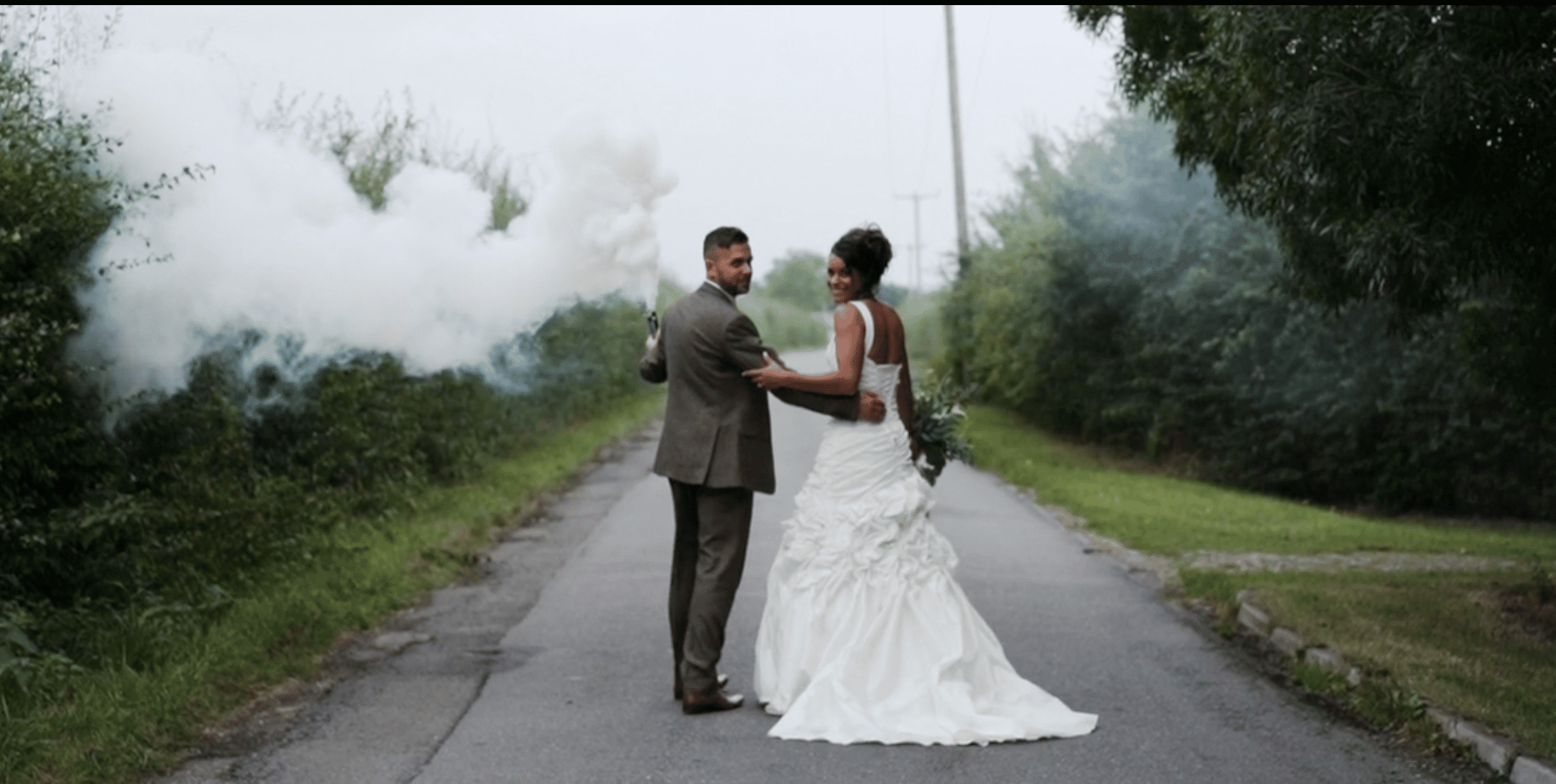 Countryside wedding venue bride and groom walk along country lane