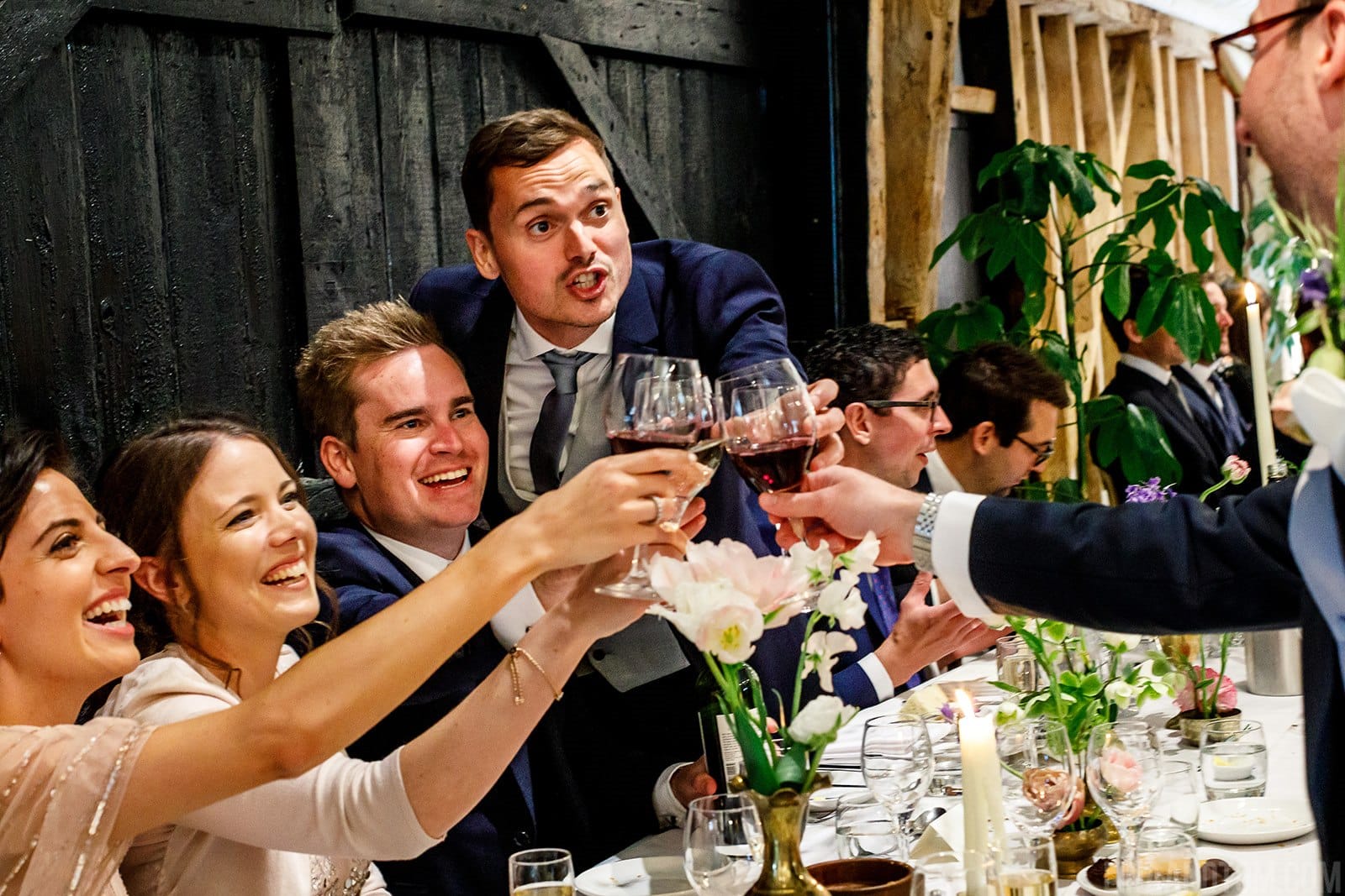 Wedding Guests Raise at Toast at South Farm Wedding Venue Cambridgeshire