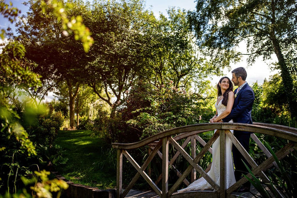 summer garden wedding bride and groom on bride at countryside wedding venue