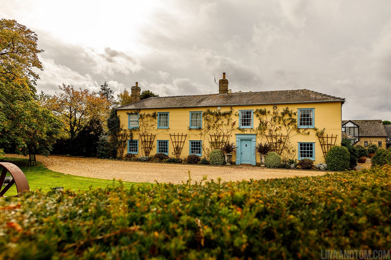 Country Farm House at Autumn Time with changing leaves