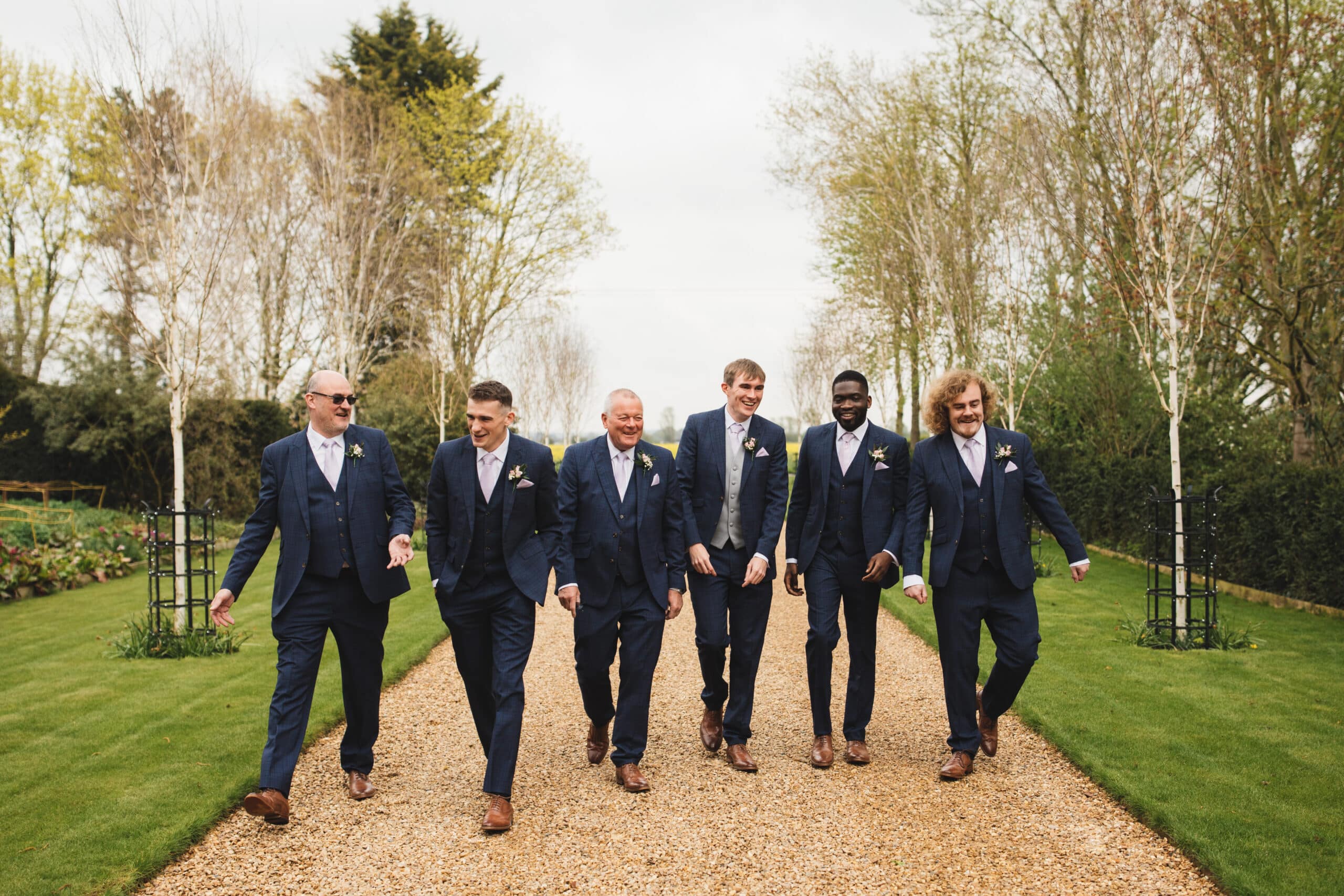 Groom and Groomsmen at Outdoor wedding venue