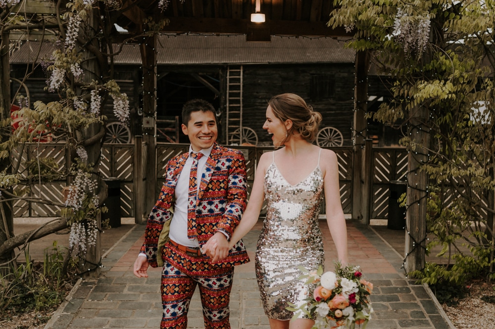 Bride and groom in incredible colourful wedding outfits
