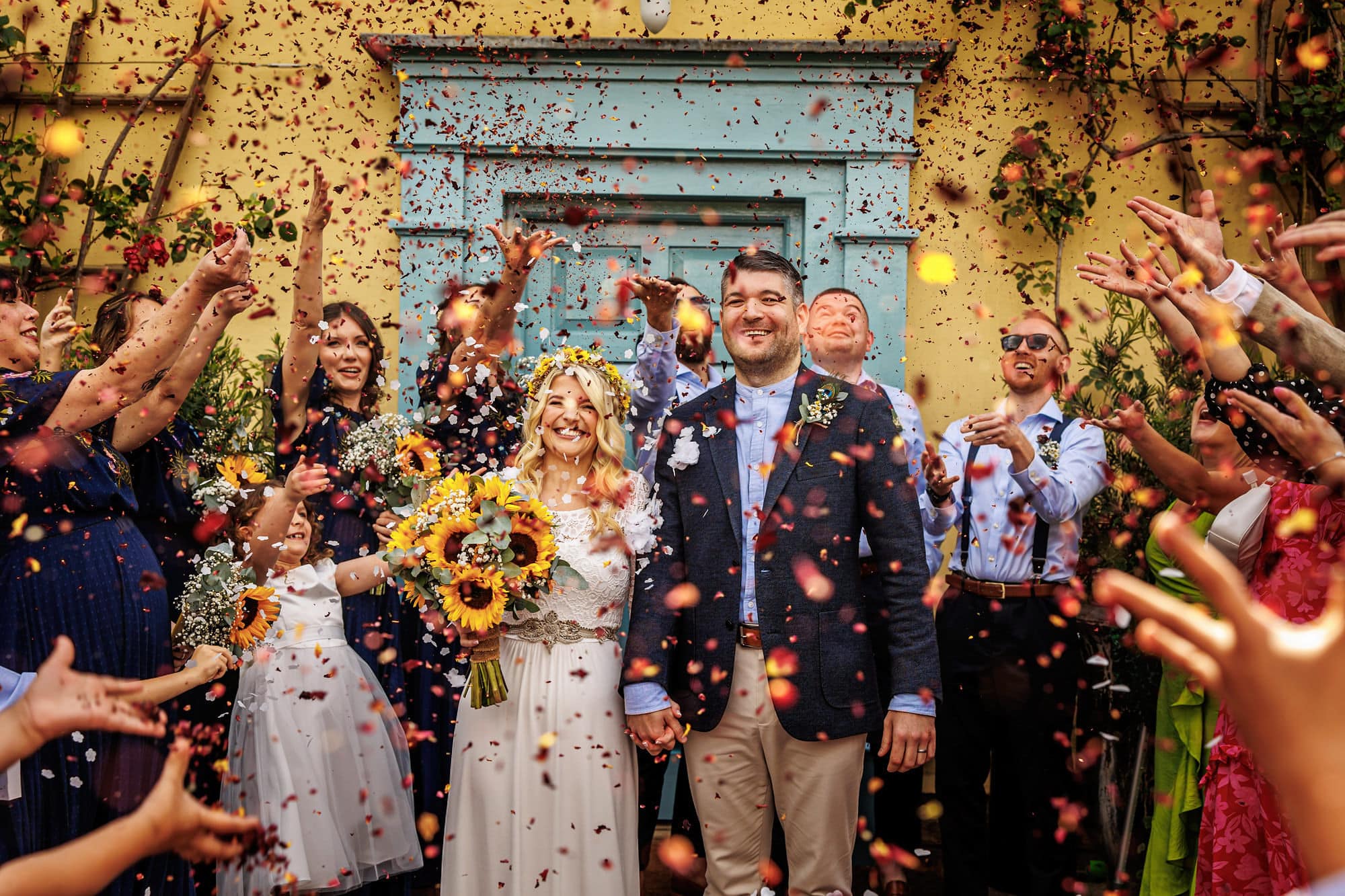 Confetti shower for bride and groom at eco wedding venue