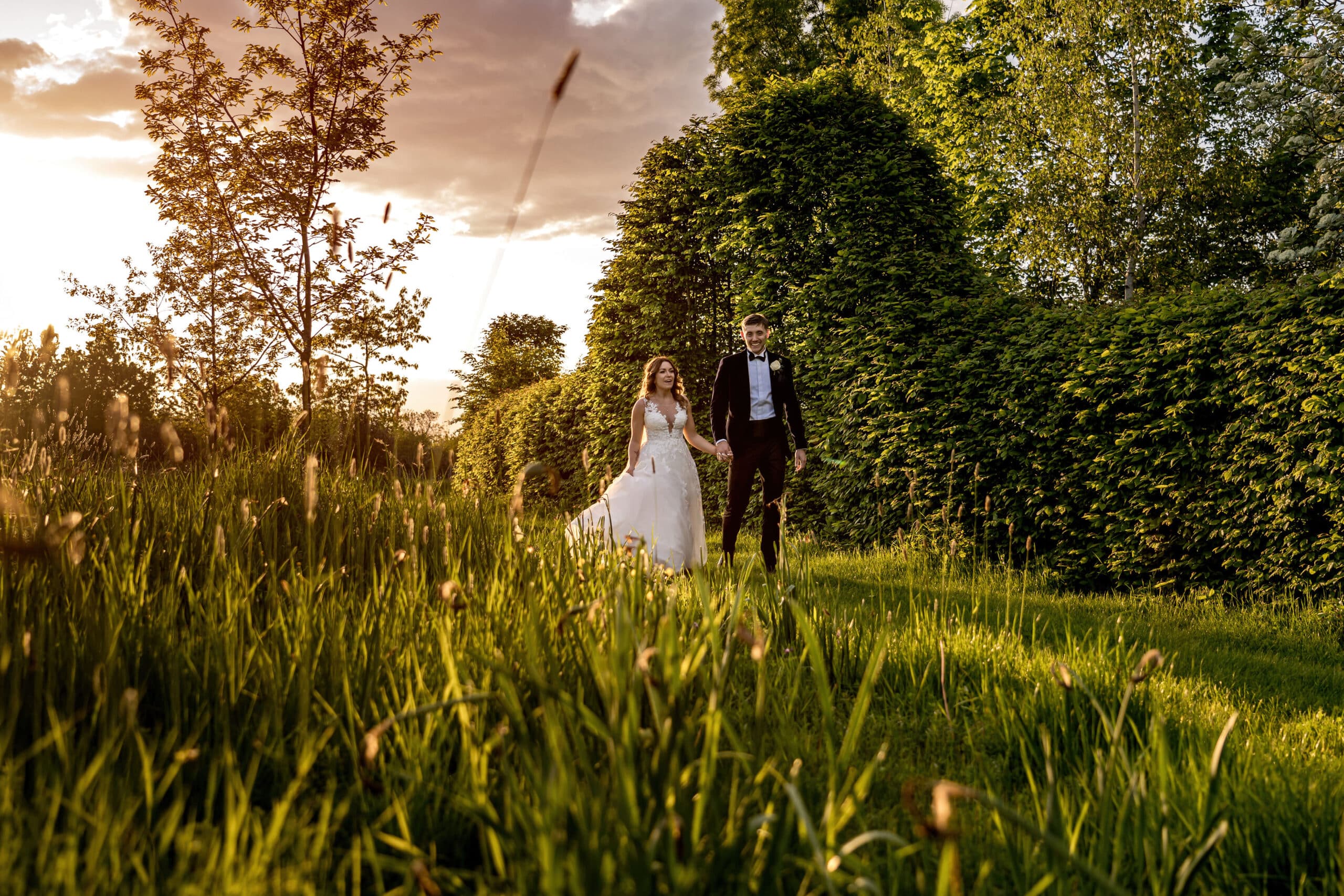 Couple enjoying the gardens at countryside wedding venue