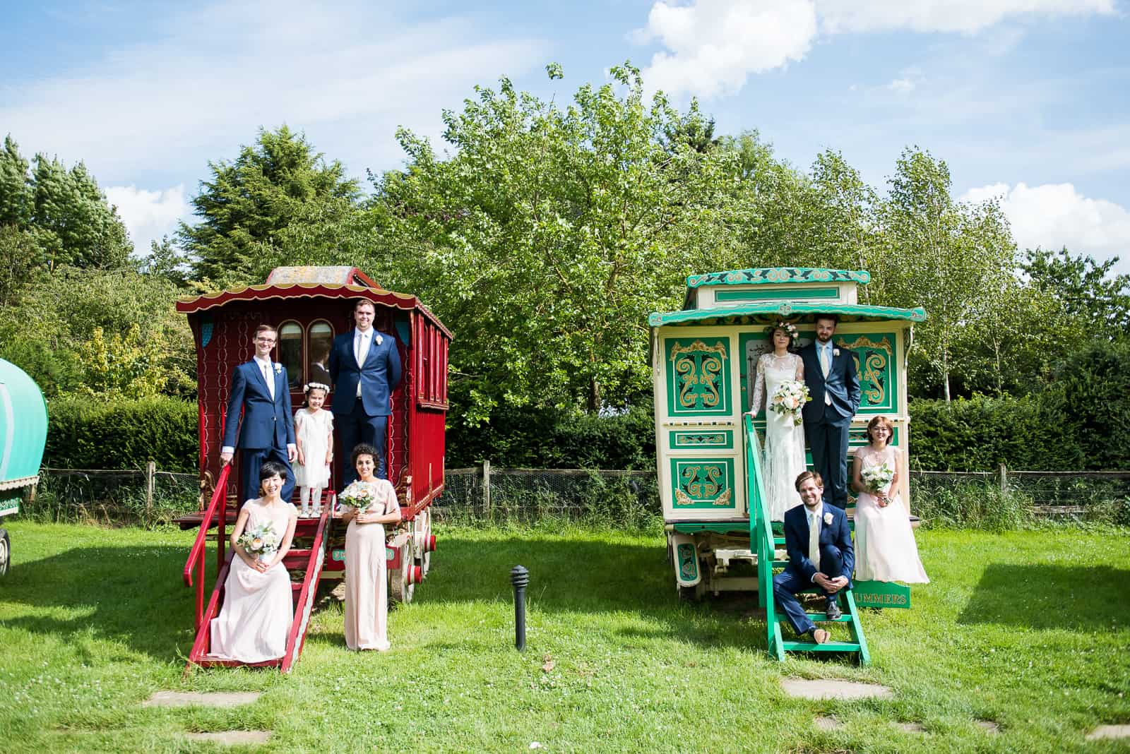 Wedding Photos in front of colourful Romany Wagons at South Farm Cambridgeshire Wedding Venue