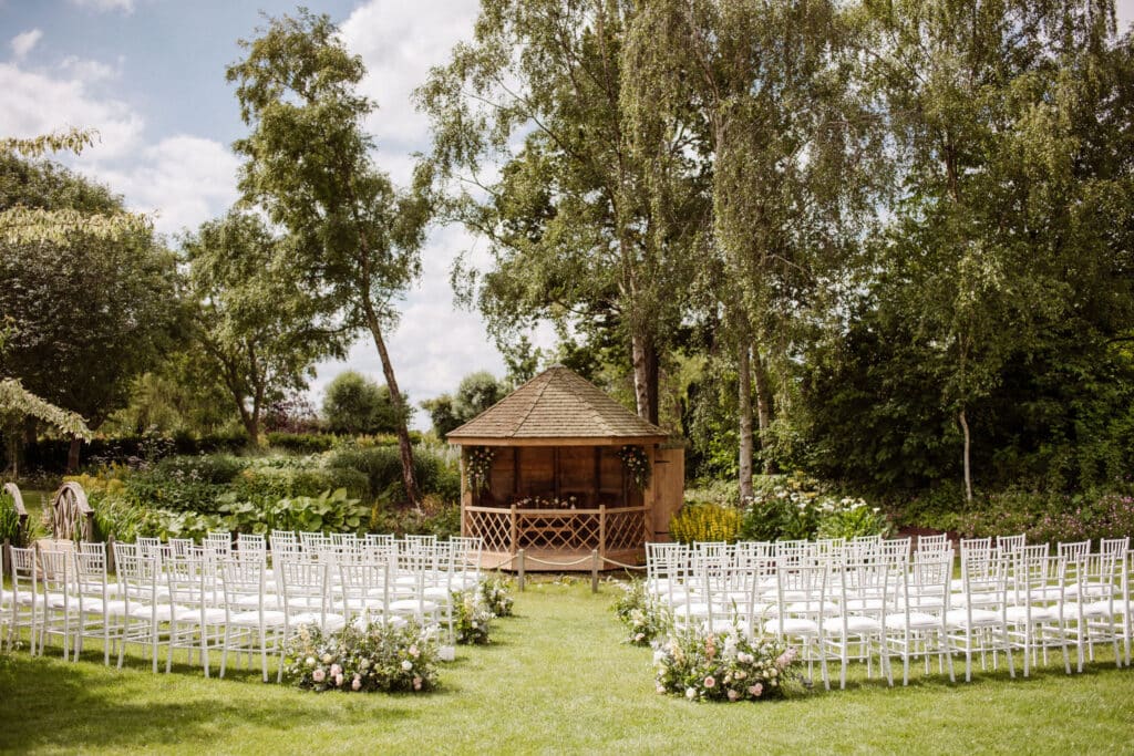 Garden wedding venue on sunny day set for wedding ceremony