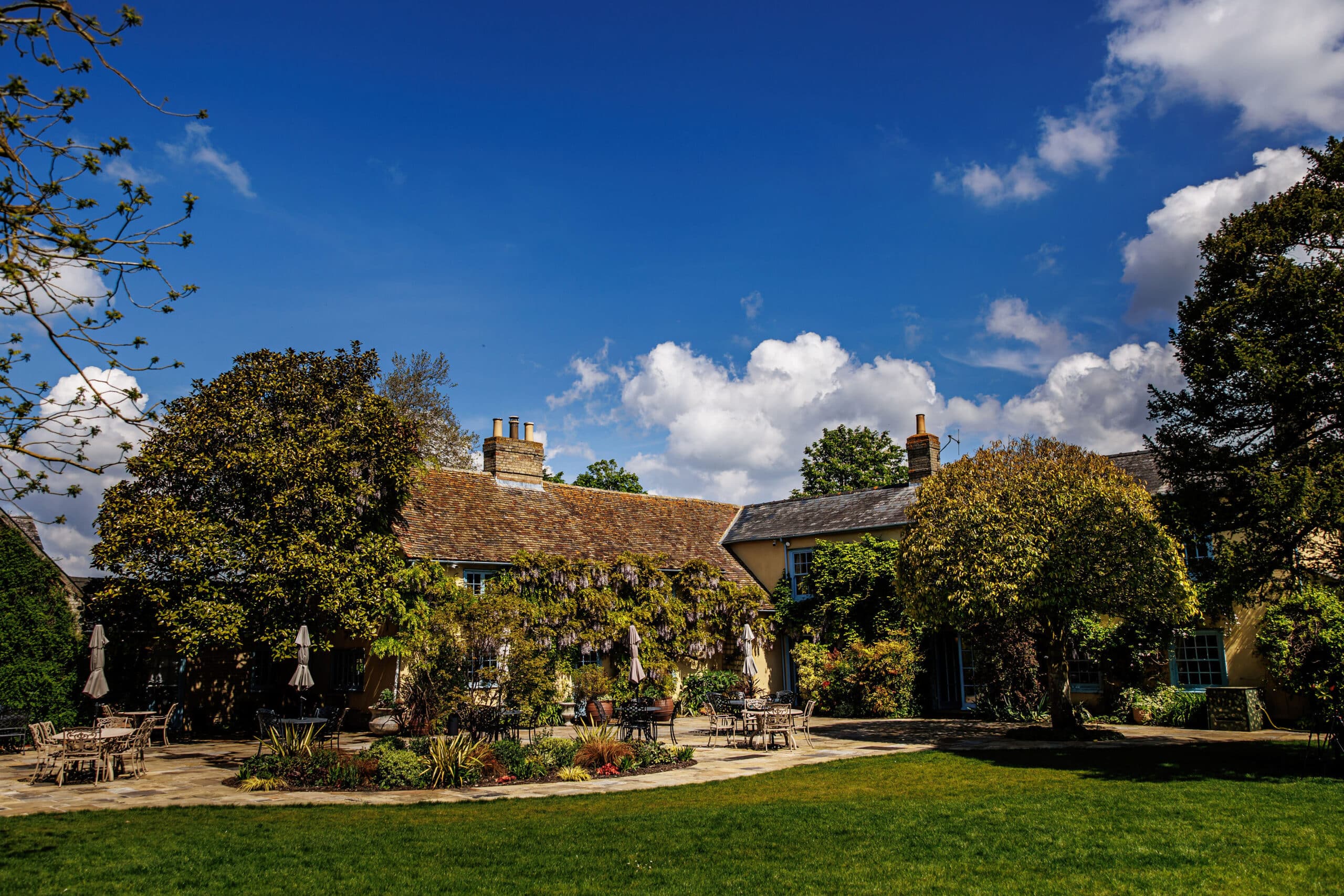 Beautiful garden of countryhouse wedding venue on a sunny spring day
