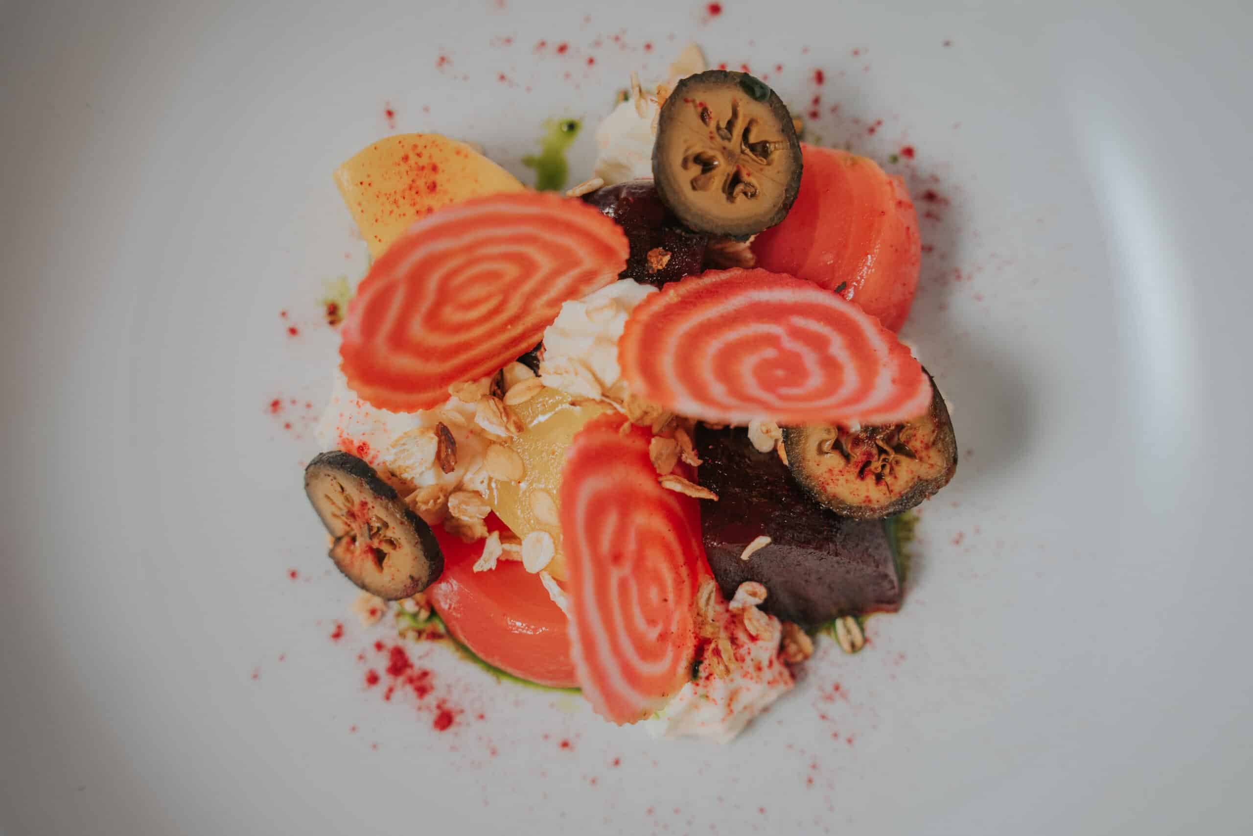 Plated starter of Garden Beetroot and Whipped Goats Cheese colourful plate of delicious home grown food at field to fork wedding venue