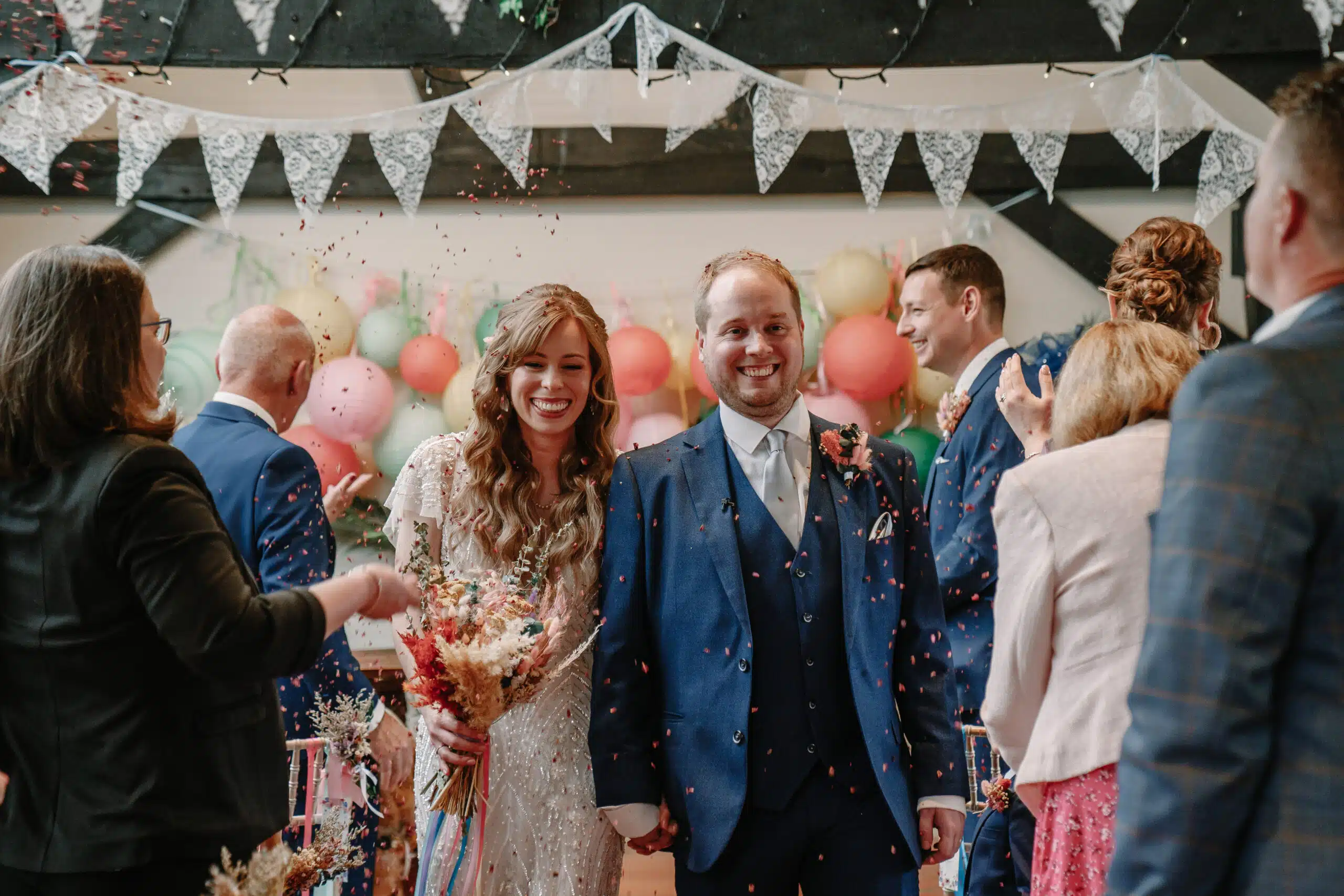 Bride and Groom walking up the aisle after saying 'I do' at countryside wedding venue based in Herfordshire
