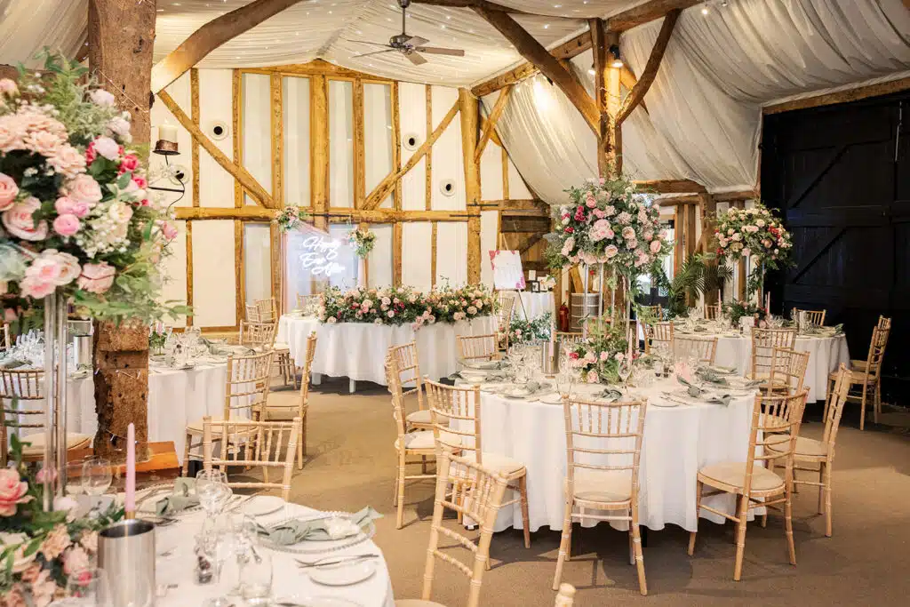 Rustic Tudor Barn all set with beautiful florals ready for the wedding breakfast 