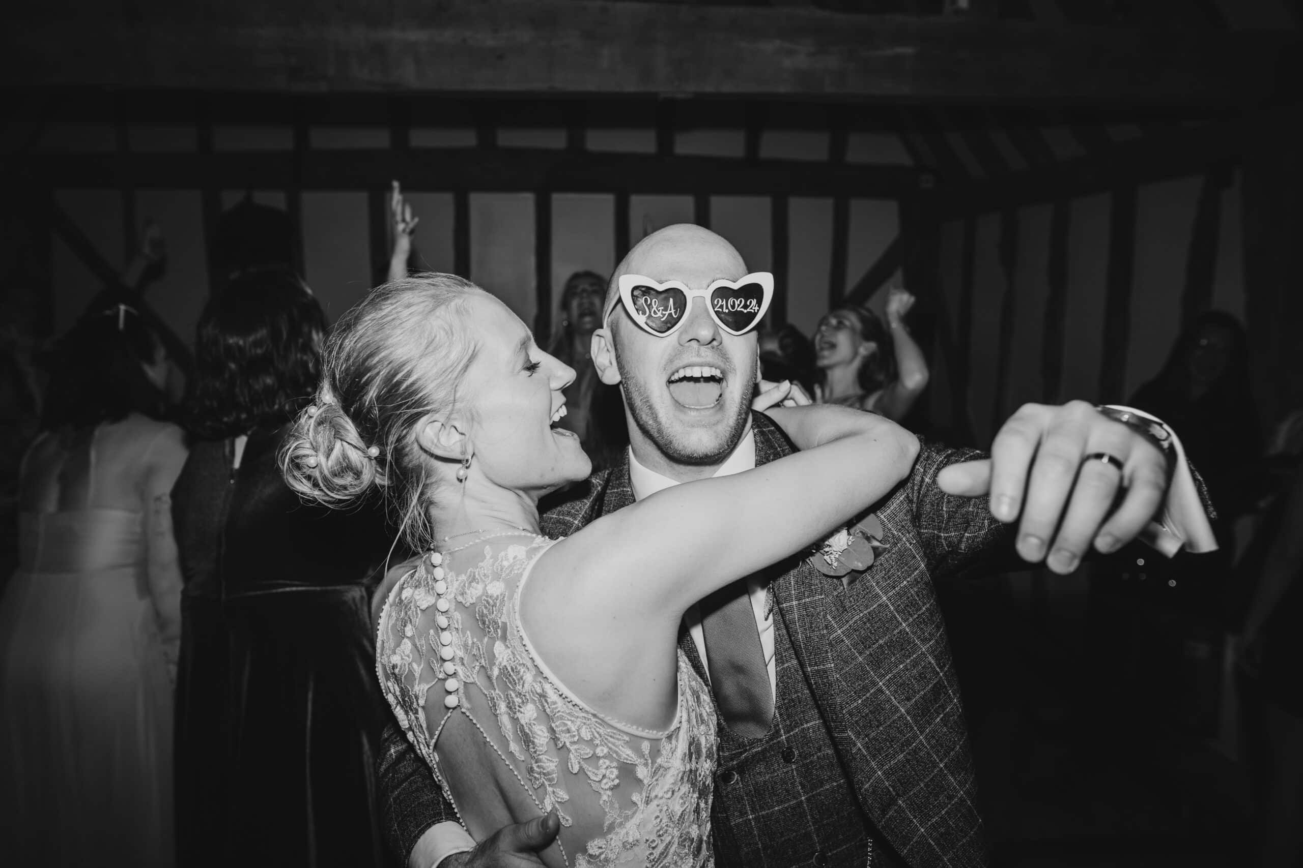 Bride and Groom dancing in the Horse Barn at charming countryside wedding venue near Cambridgshire