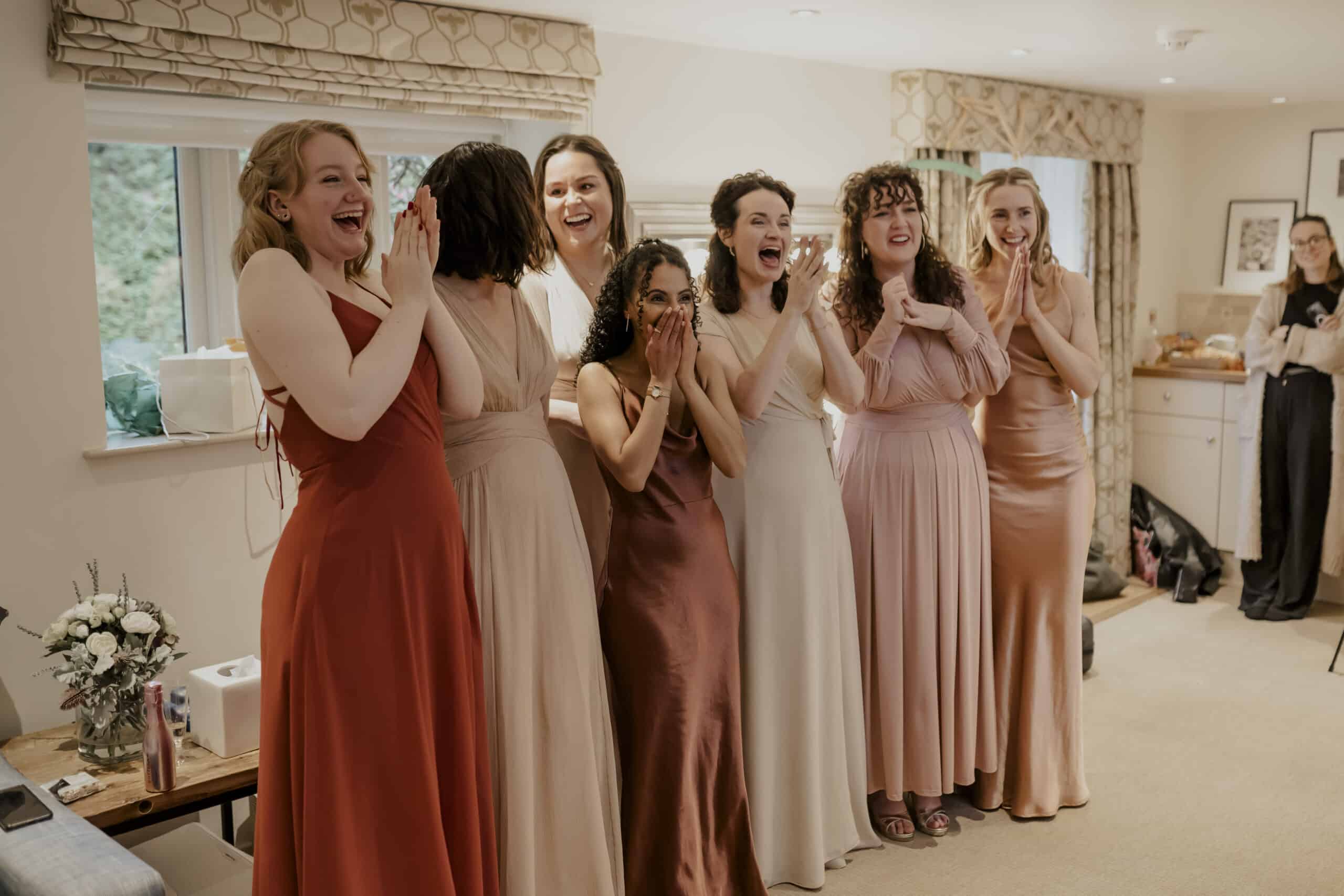 That 'First Look' with your bridesmaids in the Coach House Suite at Barn wedding venue near Bedfordshire