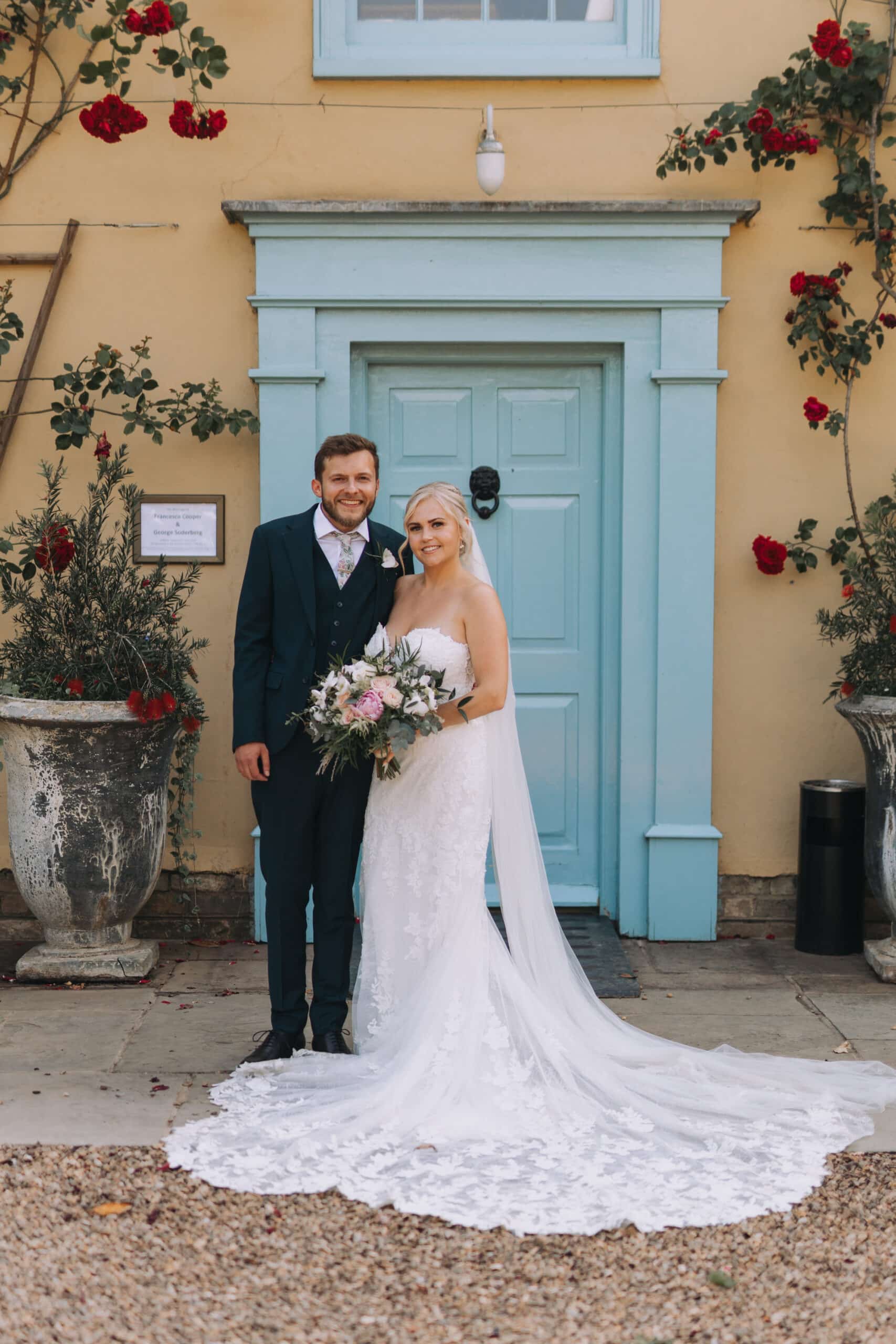 Bride and Groom having a special moment standing in front of countryside Farmhouse in Cambridgshire