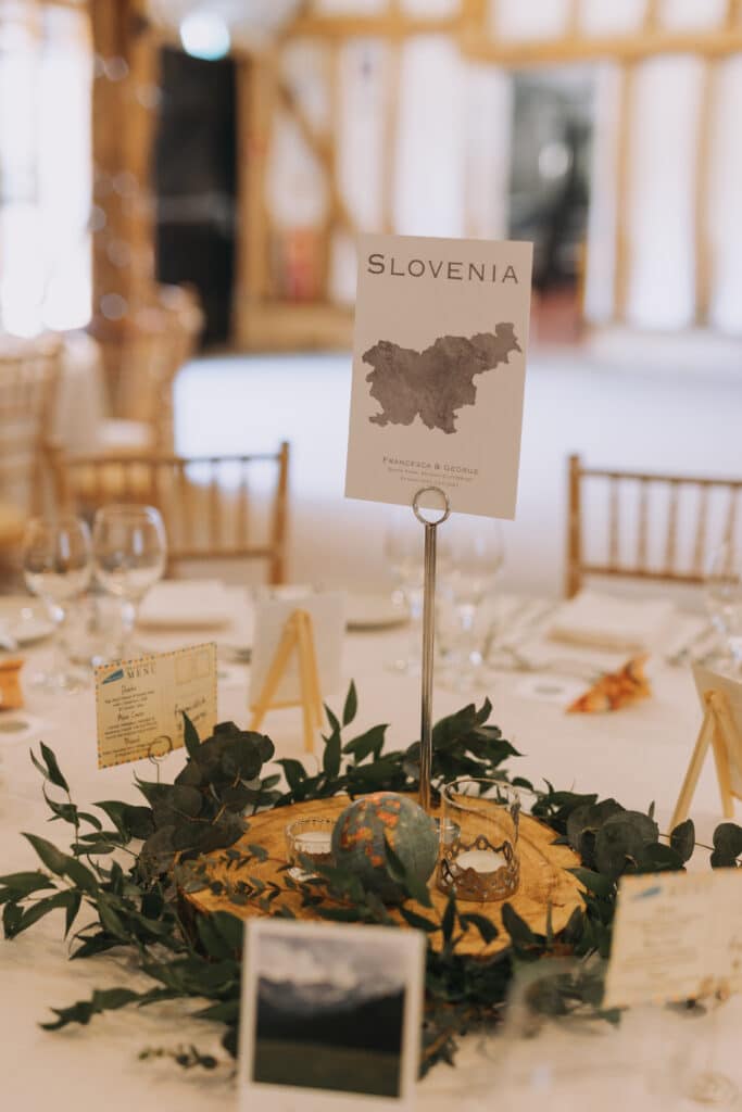 Country-themed wedding decor on the tables in rustic Tudor Barn