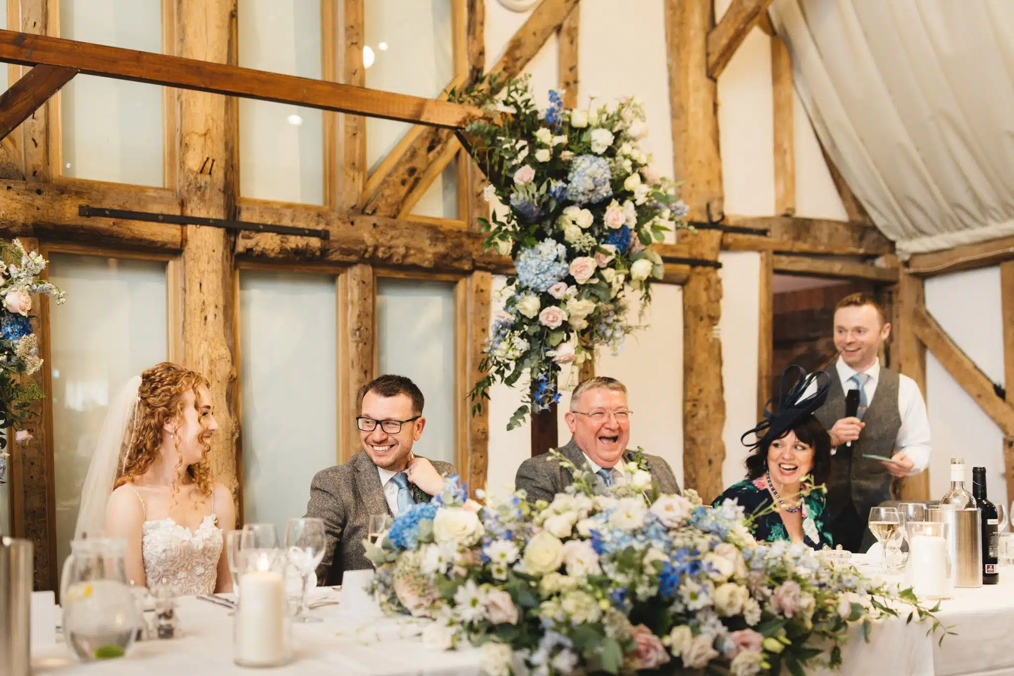 The Best Man doing his speech in the charming Tudor Barn based at countryside wedding venue in Cambridgshire