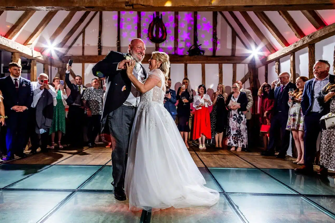 Bride and Groom enjoying their first dance in the Horse Barn