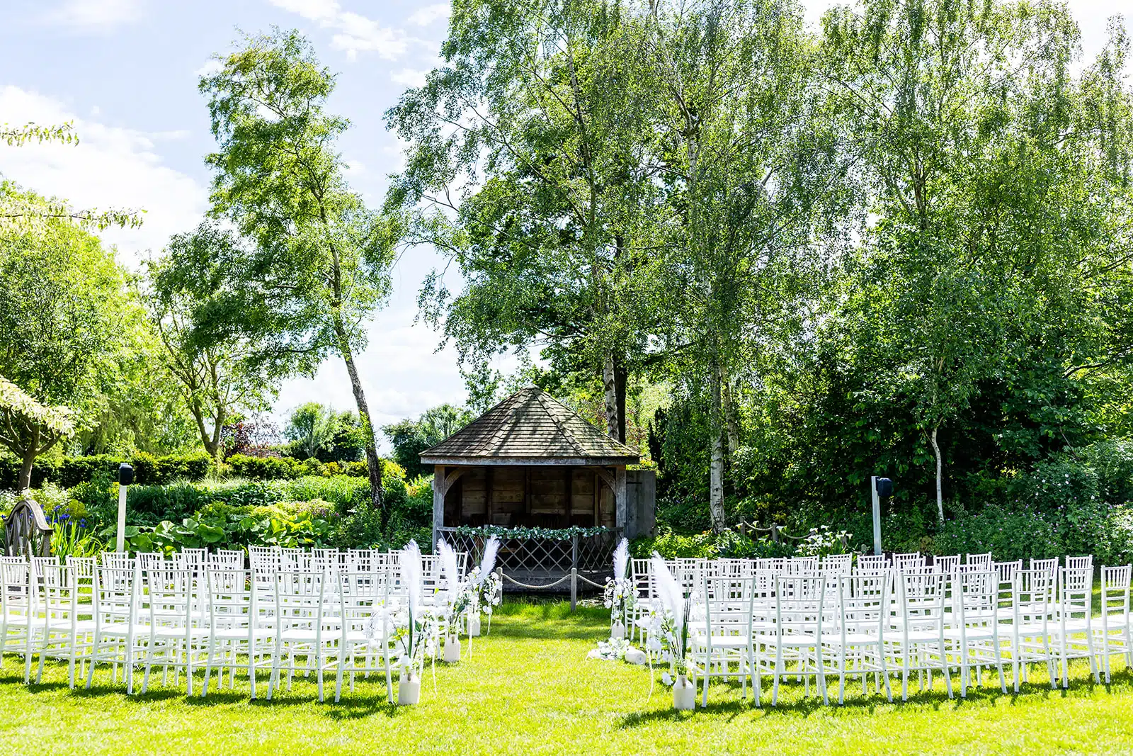 The Summer House all set for an outdoor ceremony surrounded by formal gardens at barn wedding venue