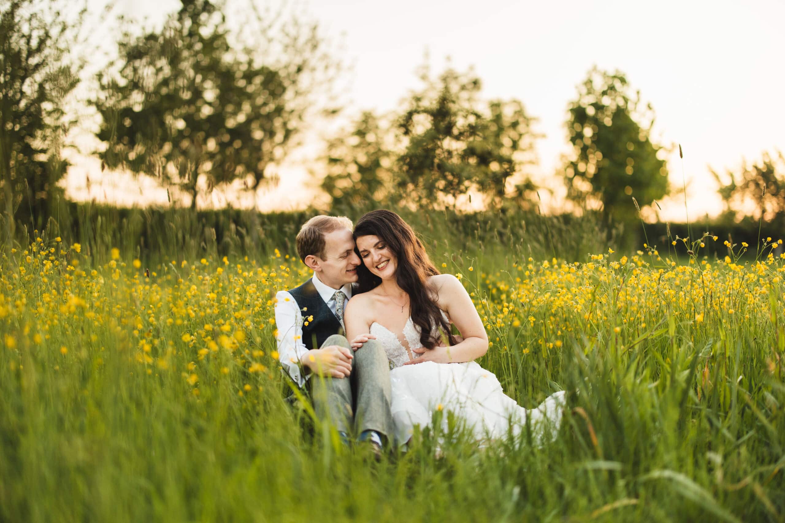 Bride and Groom in wildflower garden at May wedding at South Farm beautiful countryside wedding venue